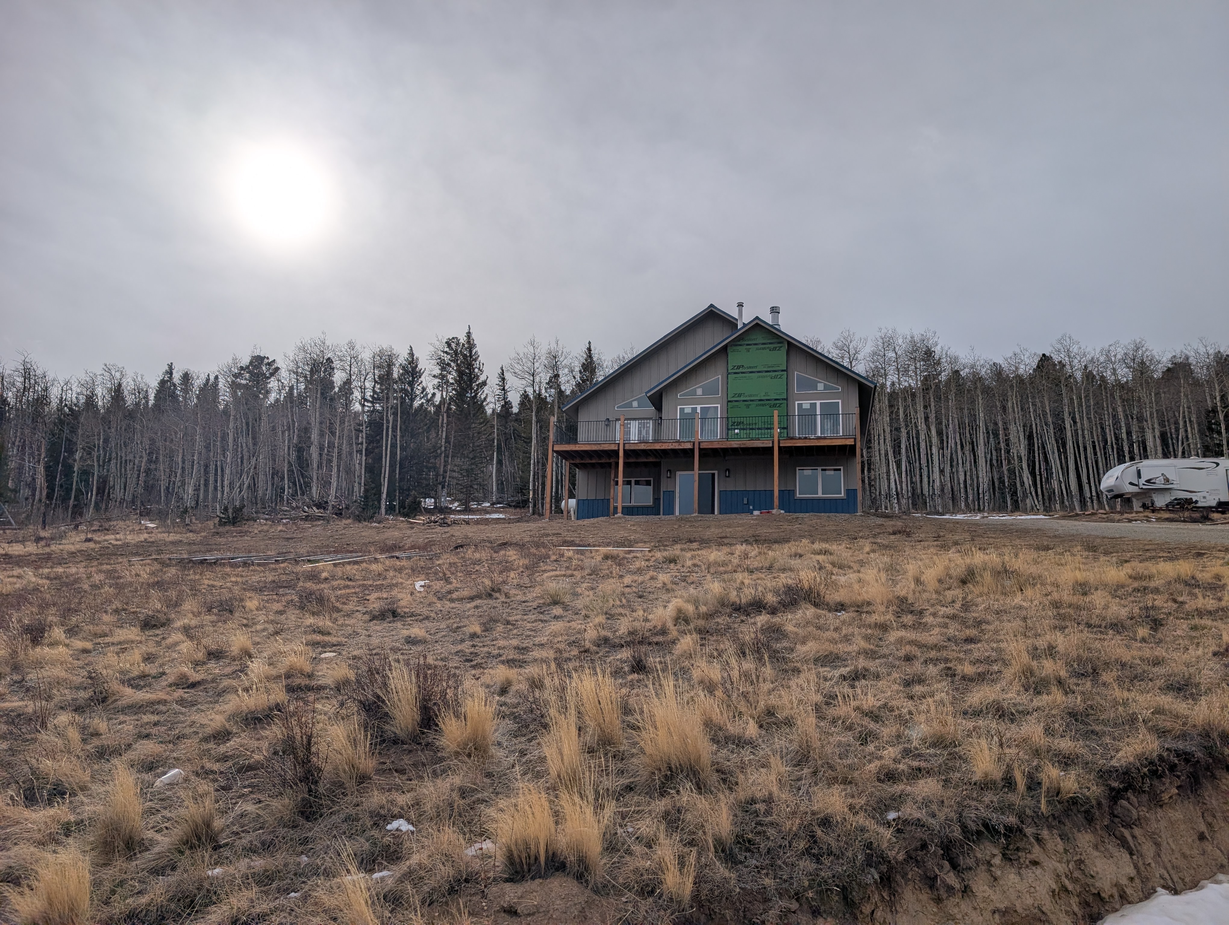 Metal roof on a Colorado mountain home surrounded by forest